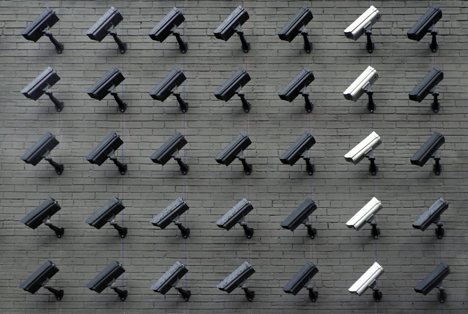 Security control room with multiple surveillance monitors